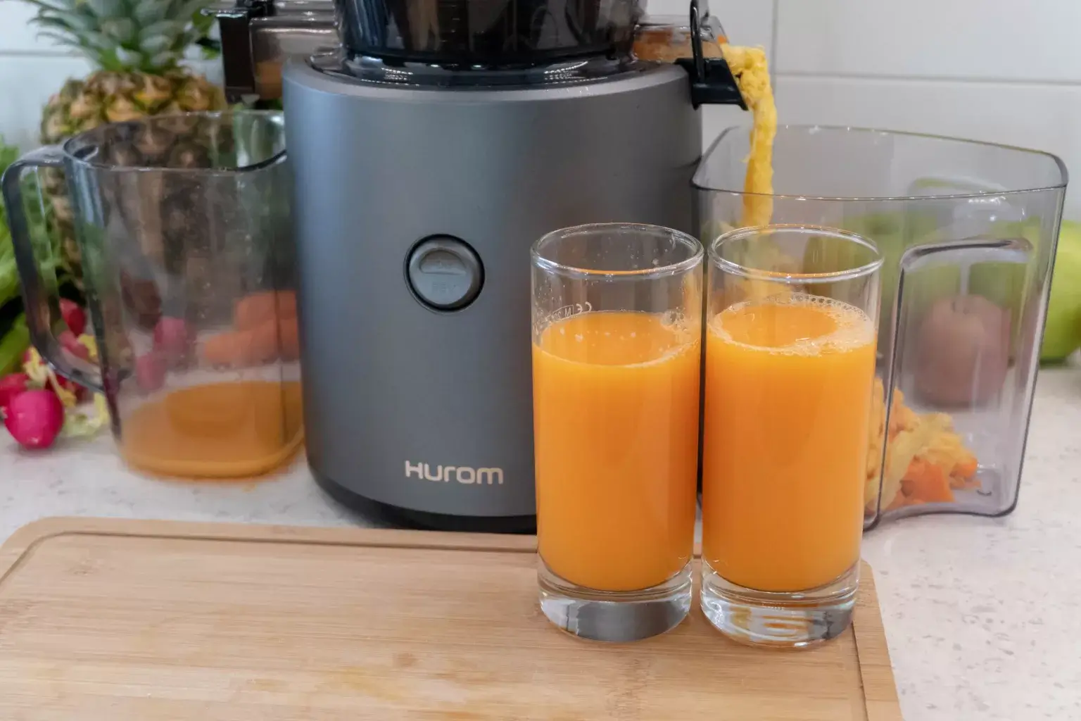 Carrot, Ginger & Orange juiced and poured in a glass as a cold pressed juice