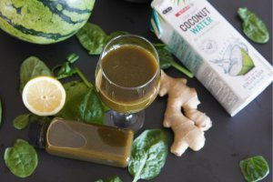 Glass of juice that can help you cure hangover. There is also spinach leaves, ginger, coconut water, lemon and watermelon